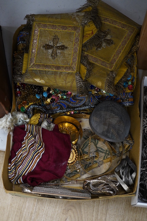 Two trunks containing a collection of children’s fancy dress from early 20th century, including an unusual child’s ‘pearly king’ suit, two earlier stockinette hats, a length of long silver metal fringing, ribboning etc.,